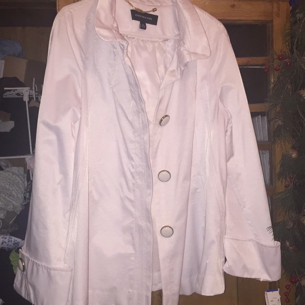 Crisp, white water repellent rain coat.